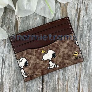Coach X Peanuts Slim Id Card Case In Signature Canvas With Snoopy Print Wallet